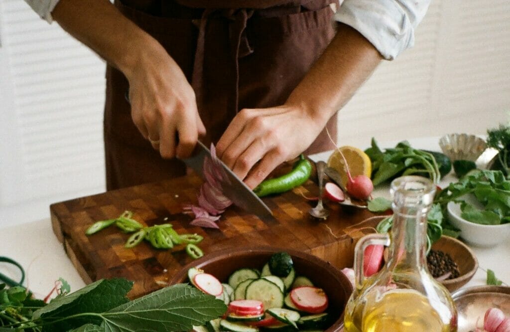 Using chef knife tucked fingers.