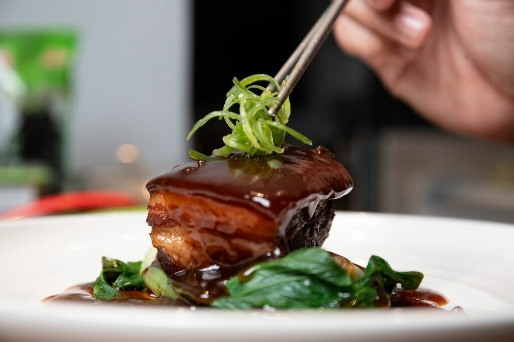 braised cooking method pork belly dressed in a plate