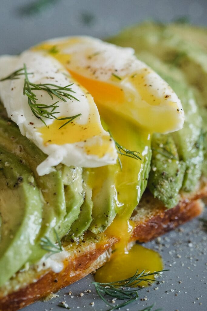 poached cooking method egg on an avocado toast